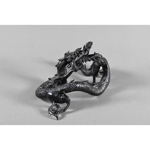 579 - A Chinese bronze three-clawed Mizuchi Dragon, modelled with long scaly, sinuous body and fierce expr... 