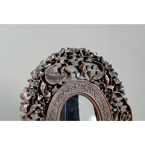 580 - A late 19th or early 20th century Chinese Canton oval hardwood glazed frame with reticulated floral ... 