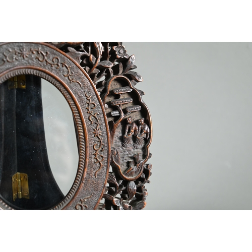 580 - A late 19th or early 20th century Chinese Canton oval hardwood glazed frame with reticulated floral ... 