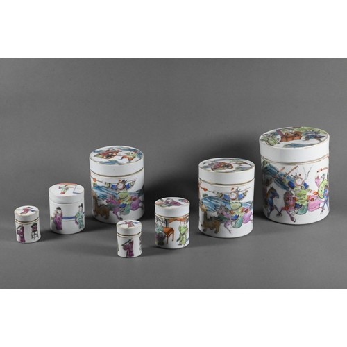 581 - A set of four Chinese 19th century famille rose nesting lidded boxes of cylindrical form, painted in... 