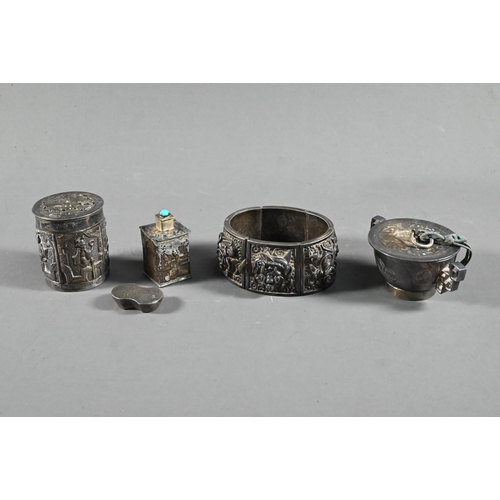 585 - A mixed lot of Asian collectibles including a 19th century South Indian silver swami ware bracelet, ... 