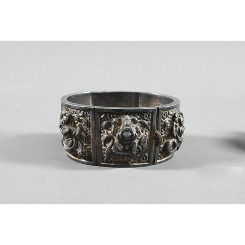 585 - A mixed lot of Asian collectibles including a 19th century South Indian silver swami ware bracelet, ... 