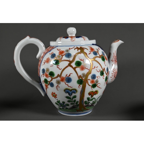 586 - A Japanese Arita Imari teapot, milk jug and sugar bowl with Aoki Bothers marks, painted in underglaz... 