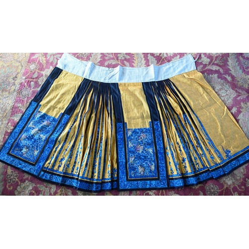 591 - An early 20th century Chinese pleated skirt, Qun, late Qing or Republic period, the yellow damask gr... 