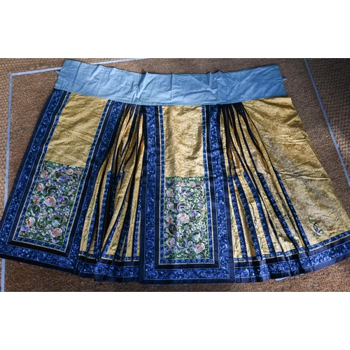 592 - An early 20th century Chinese pleated skirt, Qun, late Qing or Republic period, the yellow damask gr... 