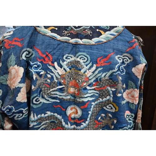 593 - A Chinese blue gauze brocade-woven dragon robe, late Qing period, woven design with nine dragons amo... 