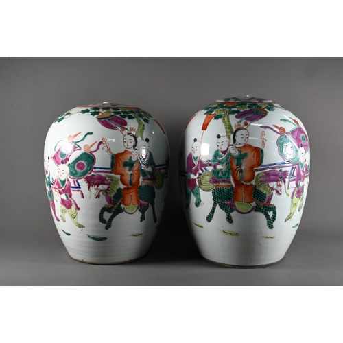 596 - A pair of 19th century Chinese famille rose ovoid vases with covers (missing finials) painted in pol... 