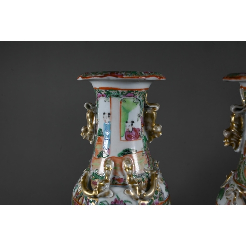 598 - A pair of 19th century Chinese canton famille rose vases, baluster form with everted foliate rims ap... 