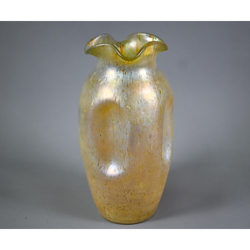 602 - A large Loetz-type iridescent glass vase with wavy rim and dimpled body (unmarked), 28 cm