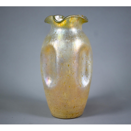 602 - A large Loetz-type iridescent glass vase with wavy rim and dimpled body (unmarked), 28 cm