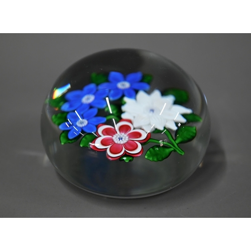 614 - A modern Saint-Louis (France) glass paperweight with floral specimen, 1986 dated on cane, 8cm diam