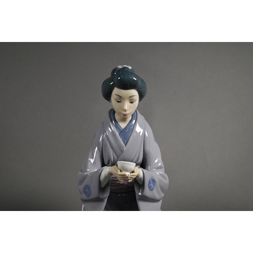 619 - Three Lladro figures, Japanese Girl Serving Tea 5122, Schoolgirl 5148 (on 'E') and Thursday's Child ... 