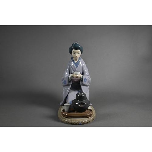 619 - Three Lladro figures, Japanese Girl Serving Tea 5122, Schoolgirl 5148 (on 'E') and Thursday's Child ... 