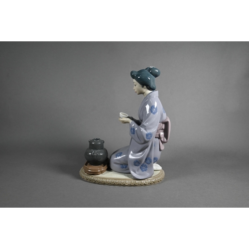 619 - Three Lladro figures, Japanese Girl Serving Tea 5122, Schoolgirl 5148 (on 'E') and Thursday's Child ... 