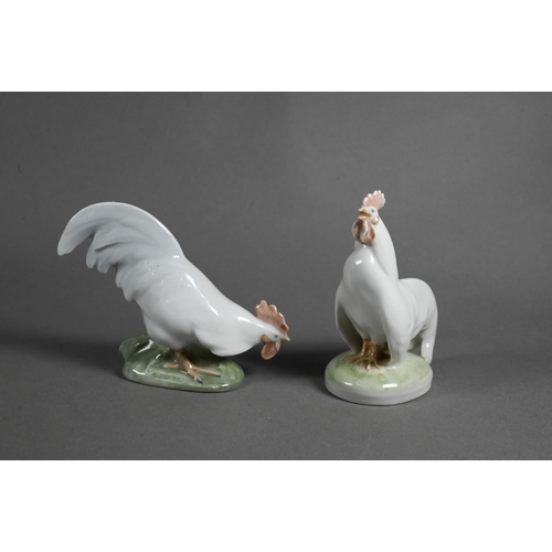 626 - A Royal Copenhagen group, Cockerel and Hen 1094, 24 cm, to/w two small roosters 1126/27 and a blue a... 