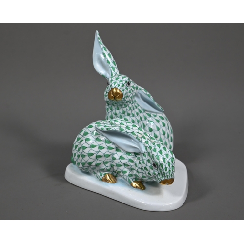 630 - A Herend group of two hares, hand-painted and gilded with green scales, no. 5332, 14 cm high