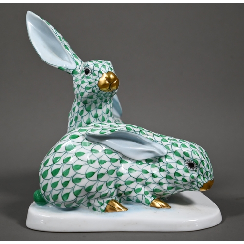 630 - A Herend group of two hares, hand-painted and gilded with green scales, no. 5332, 14 cm high