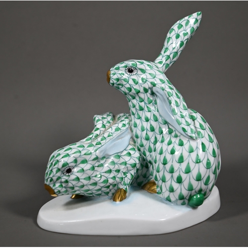 630 - A Herend group of two hares, hand-painted and gilded with green scales, no. 5332, 14 cm high