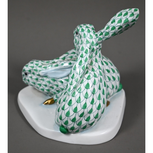 630 - A Herend group of two hares, hand-painted and gilded with green scales, no. 5332, 14 cm high