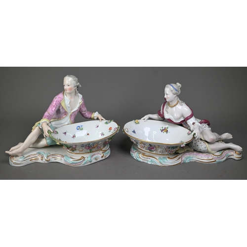 636 - A pair of 19th century Meissen bonbon dishes modelled as floral painted and encrusted baskets held b... 