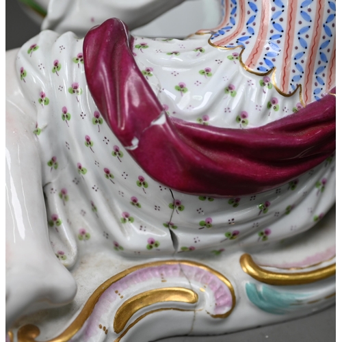 636 - A pair of 19th century Meissen bonbon dishes modelled as floral painted and encrusted baskets held b... 