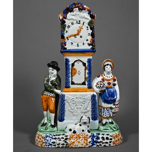 638 - A Georgian Pratt-type pearlware money-box, modelled as a longcase clock flanked by a young couple an... 