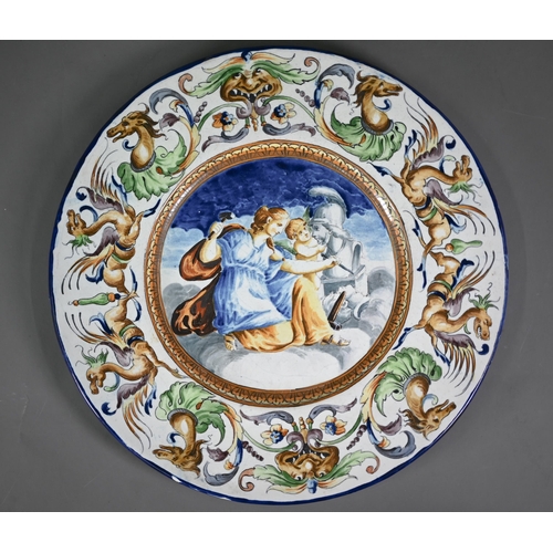 645 - A pair of 19th century Italian majolica chargers in the Istoriato tradition, depicting Jupiter and V... 