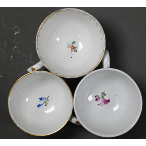 649 - Three 18th century Dutch porcelain small tea cups, The Hague factory - one finely-painted with squas... 