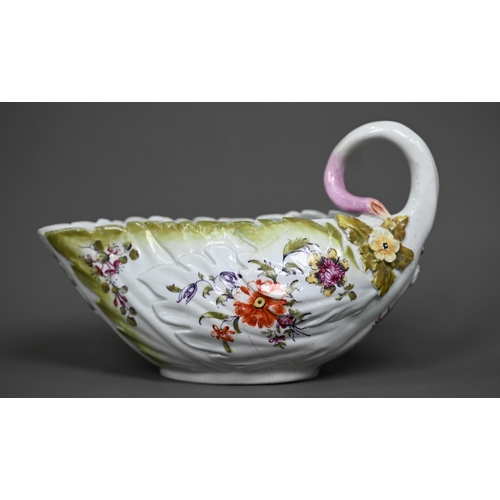 650 - A Chelsea Derby porcelain leaf-moulded sauce-boat with applied floral decoration, organic handle and... 