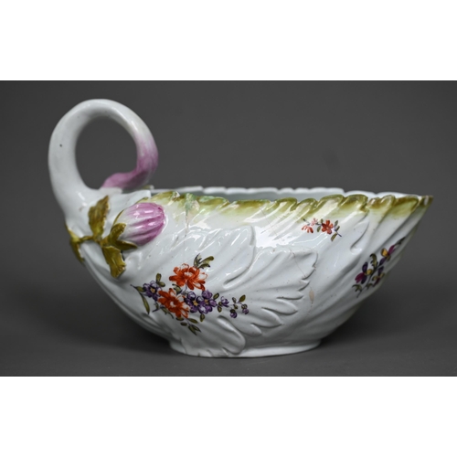 650 - A Chelsea Derby porcelain leaf-moulded sauce-boat with applied floral decoration, organic handle and... 