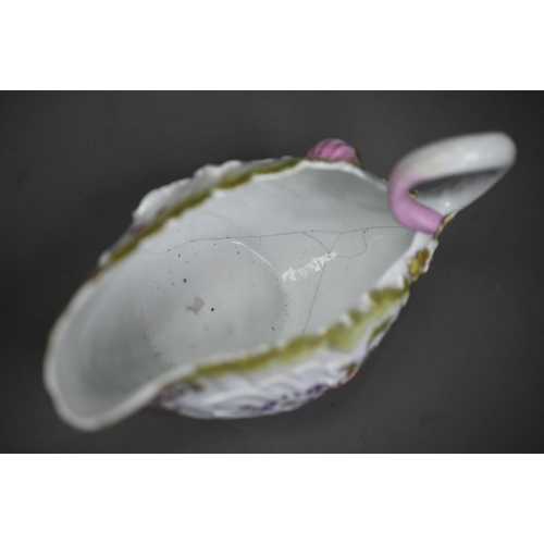 650 - A Chelsea Derby porcelain leaf-moulded sauce-boat with applied floral decoration, organic handle and... 