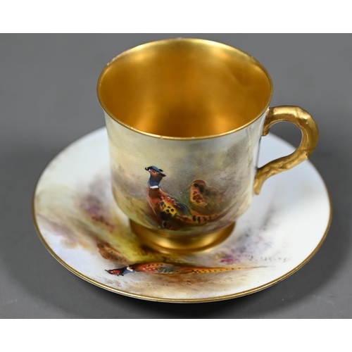 660 - A Royal Worcester cabinet coffee cup and saucer with gilt interior, painted with pheasants by James ... 