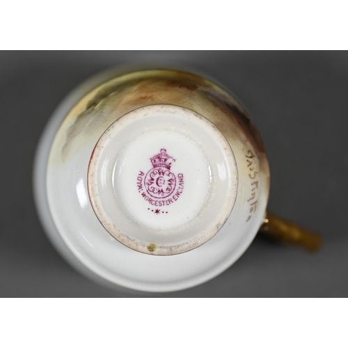 660 - A Royal Worcester cabinet coffee cup and saucer with gilt interior, painted with pheasants by James ... 