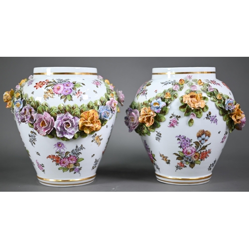 668 - A good pair of German porcelain vases, the domed covers surmounted by an 18th century lady and gentl... 