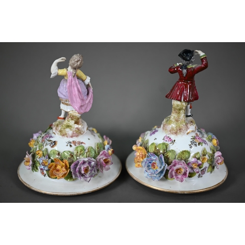 668 - A good pair of German porcelain vases, the domed covers surmounted by an 18th century lady and gentl... 