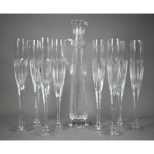 688 - A set of seven Thomas Goode large glass champagne flutes, 40 cm high, to/w a similar tall and slende... 