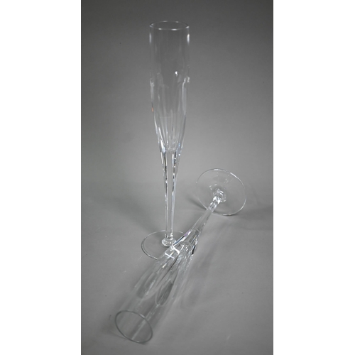 688 - A set of seven Thomas Goode large glass champagne flutes, 40 cm high, to/w a similar tall and slende... 