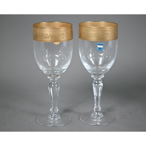 689 - A set of six Murano wine glasses with decorative gilt rims, 19 cm high