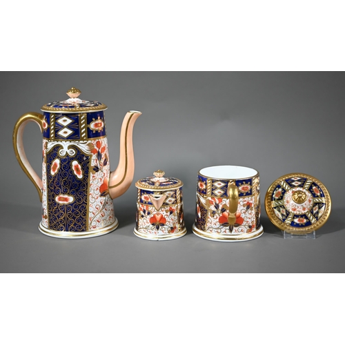 694 - A Davenport coffee pot with cream and sugar pair, decorated in the Crown Derby Imari manner, to/w fi... 