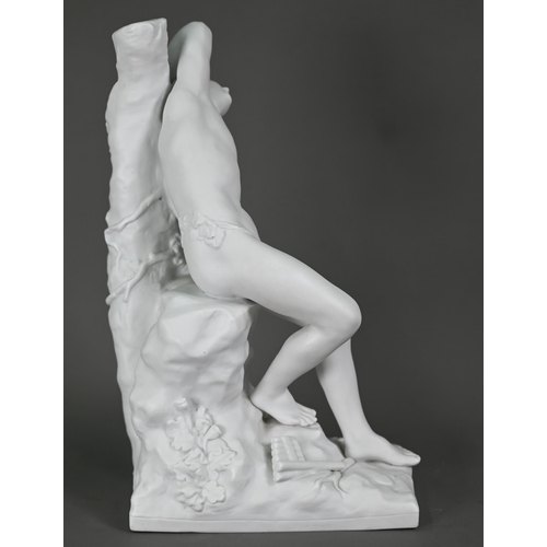 697 - A Parian porcelain figure of a drunken Bacchanalian youth, resting on a convenient rock, 30 cm high