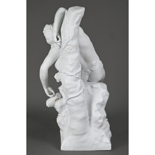 697 - A Parian porcelain figure of a drunken Bacchanalian youth, resting on a convenient rock, 30 cm high