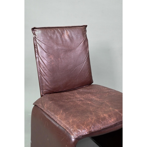 906 - In the manner of Mario Bellini, an Italian single black leather chair in the style of the 'Break' mo... 