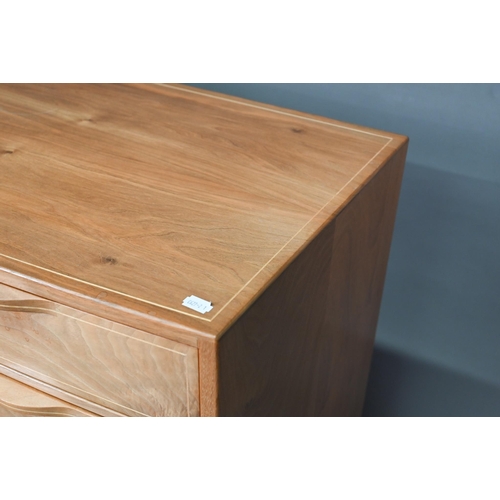 909 - Edward Barnsley (1900-1987), an inlaid sycamore chest of four long graduated drawers, raised on slen... 