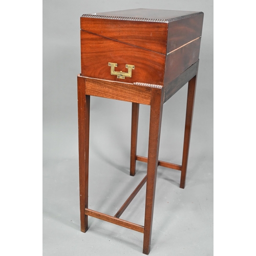 910 - A Victorian figured mahogany campaign style writing box, with flush brass handles, on associated sta... 