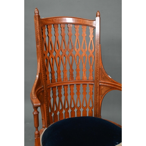 911 - A Victorian Sheraton style inlaid satinwood chair, with fret cut piered spats over a fabric panelled... 