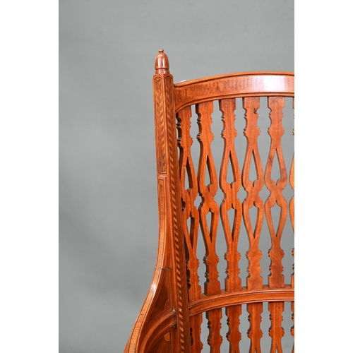 911 - A Victorian Sheraton style inlaid satinwood chair, with fret cut piered spats over a fabric panelled... 