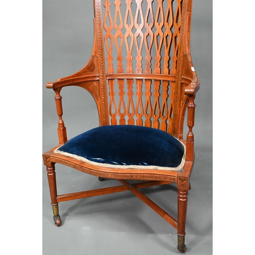 911 - A Victorian Sheraton style inlaid satinwood chair, with fret cut piered spats over a fabric panelled... 