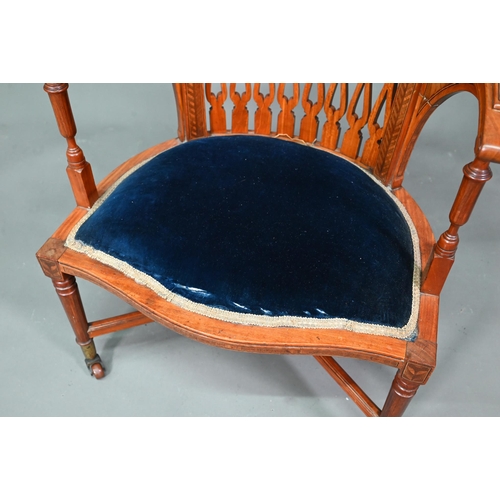 911 - A Victorian Sheraton style inlaid satinwood chair, with fret cut piered spats over a fabric panelled... 