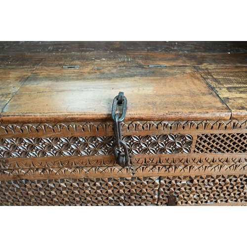 914 - A substantial Rajasthan teak 'horse head' box bench, with hinged storage compartment, 162 cm w x 87 ... 