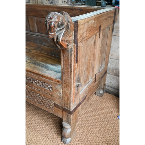 914 - A substantial Rajasthan teak 'horse head' box bench, with hinged storage compartment, 162 cm w x 87 ... 